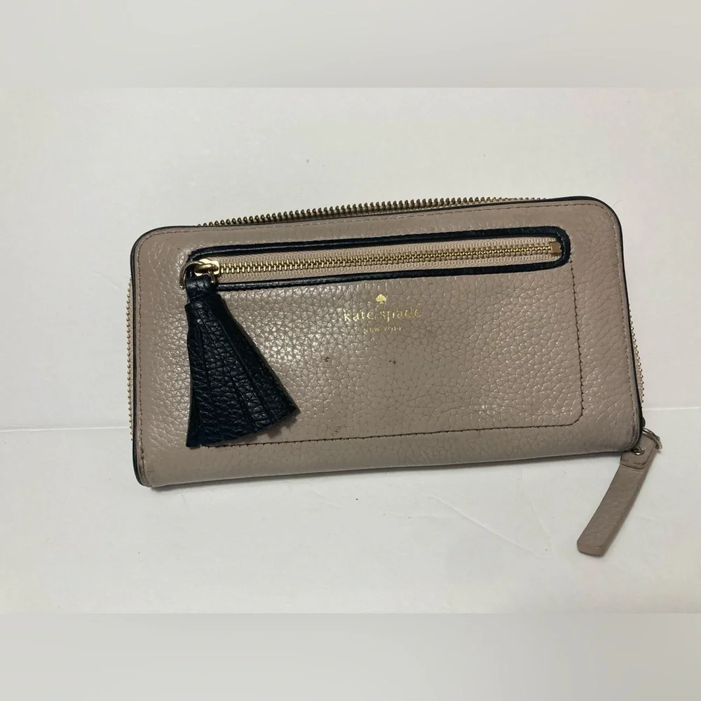 Kate Spade wallet pebble texture leather mauve color black trim tassel